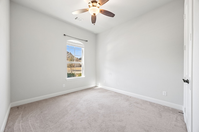 unfurnished room featuring visible vents, ceiling fan, baseboards, and carpet