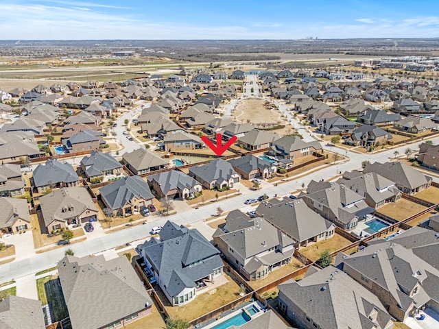 birds eye view of property with a residential view