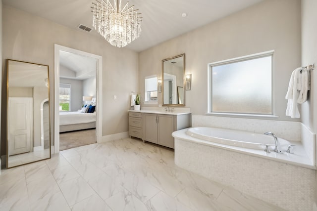 ensuite bathroom featuring visible vents, vanity, a garden tub, marble finish floor, and ensuite bath