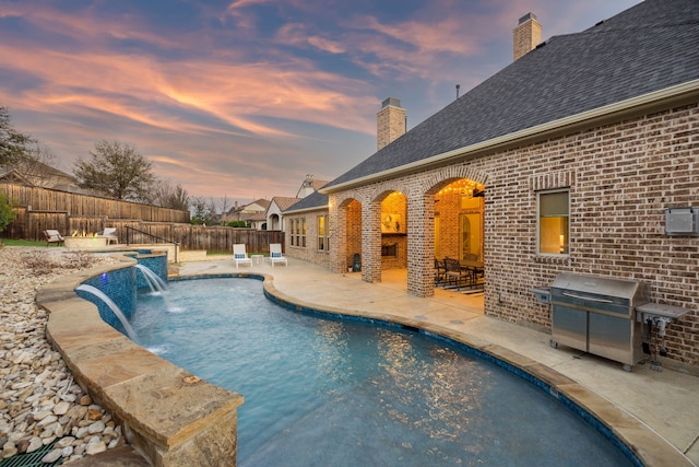 view of swimming pool with a patio area, a fenced in pool, a fenced backyard, and grilling area