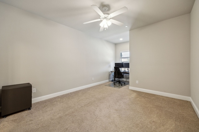 unfurnished office featuring carpet flooring, recessed lighting, baseboards, and ceiling fan