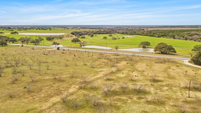 bird's eye view with a rural view and a water view