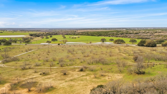 birds eye view of property with a rural view