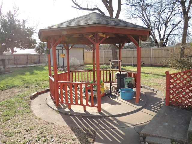 view of patio featuring a gazebo and a fenced backyard