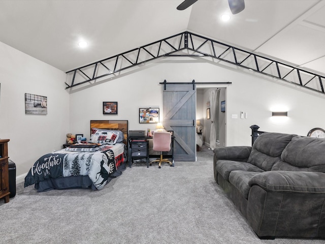 bedroom featuring vaulted ceiling, a barn door, a ceiling fan, and carpet floors