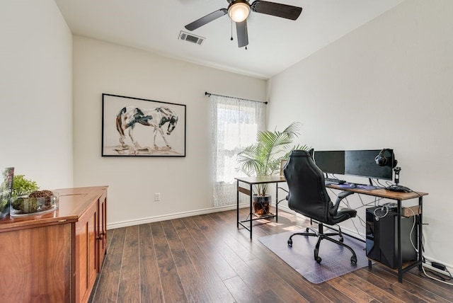 office space with visible vents, baseboards, dark wood-type flooring, and ceiling fan