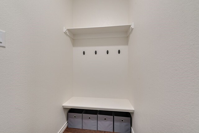 mudroom featuring a textured wall