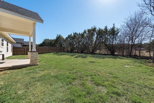 view of yard with a patio and a fenced backyard