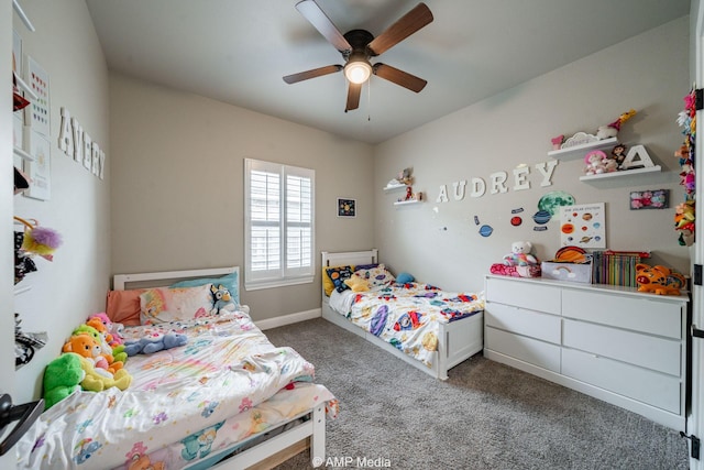 bedroom featuring baseboards, a ceiling fan, and carpet flooring