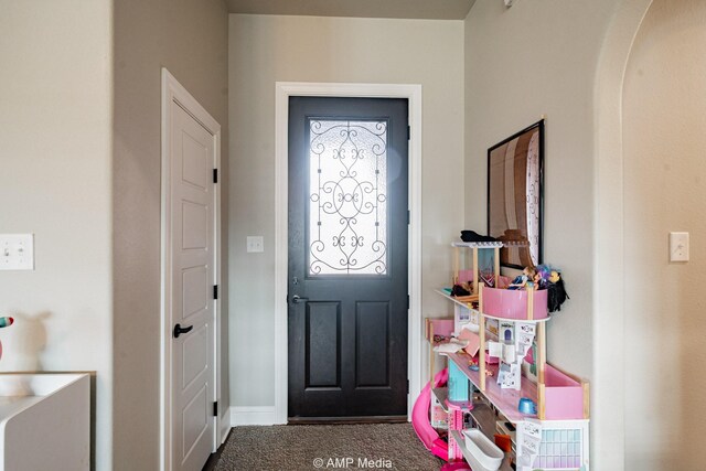 entrance foyer featuring carpet