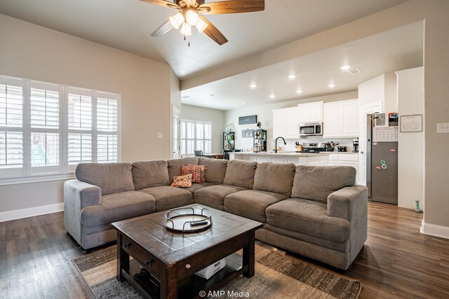 living area with recessed lighting, baseboards, dark wood finished floors, and a ceiling fan