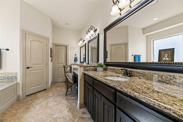 bathroom featuring a bathing tub and vanity