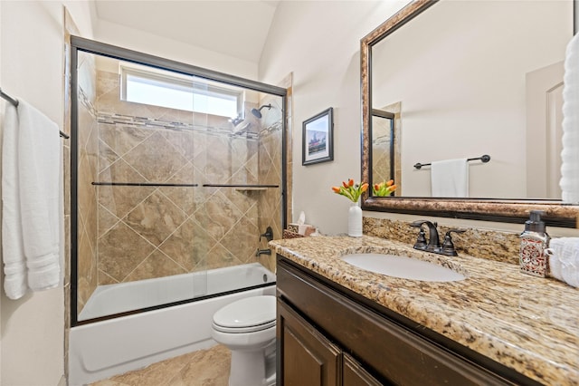 full bath with vanity, toilet, and combined bath / shower with glass door