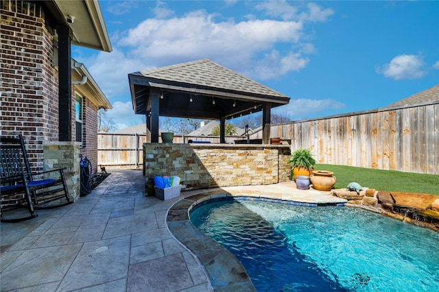 view of swimming pool featuring a gazebo, a fenced in pool, a patio, and a fenced backyard