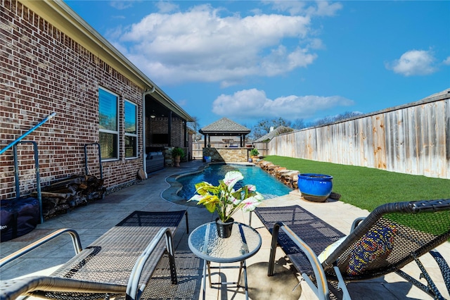 view of swimming pool with a gazebo, a fenced in pool, a fenced backyard, and a patio area