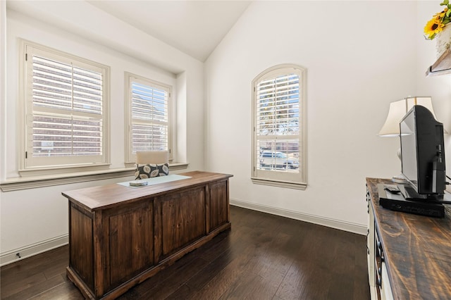 home office featuring vaulted ceiling, plenty of natural light, baseboards, and dark wood-style flooring