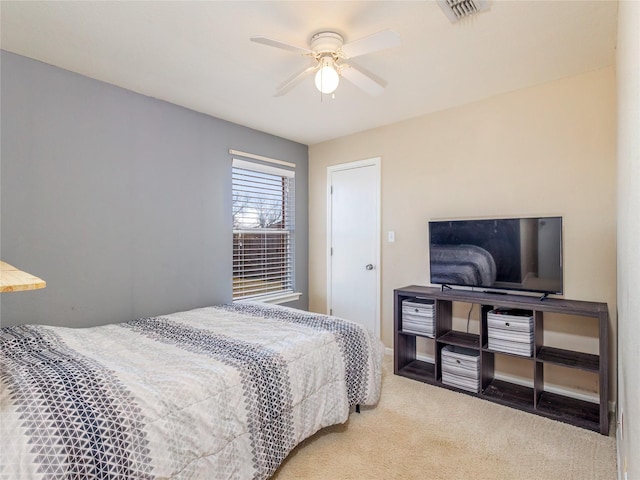 bedroom with carpet, baseboards, visible vents, and ceiling fan