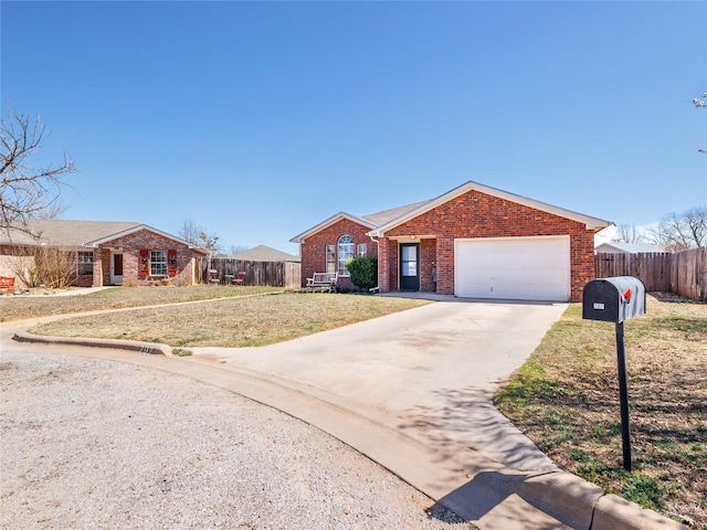 ranch-style home featuring brick siding, concrete driveway, a front yard, and fence