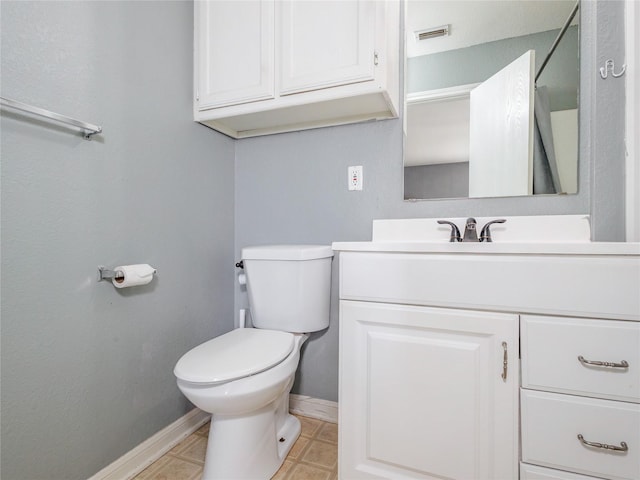 bathroom featuring visible vents, toilet, tile patterned flooring, baseboards, and vanity