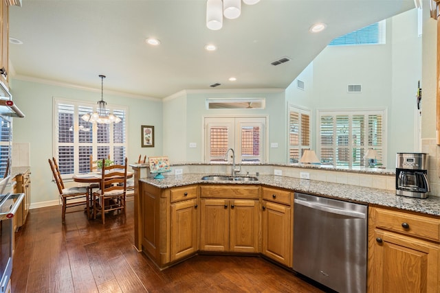 kitchen featuring visible vents, dark wood-type flooring, dishwasher, light stone counters, and a sink