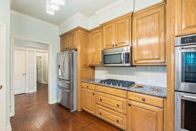 kitchen featuring crown molding, light stone counters, backsplash, and stainless steel appliances