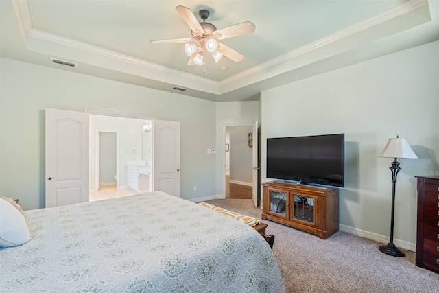 bedroom featuring visible vents, a raised ceiling, baseboards, and carpet flooring