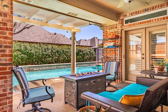 view of patio with fence, a fire pit, a pergola, and ceiling fan