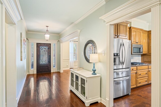 entryway featuring baseboards, dark wood-style flooring, and ornamental molding