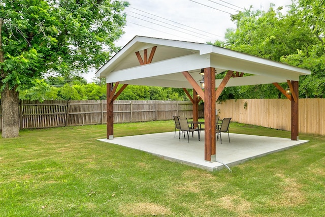 view of yard featuring a patio area, a gazebo, and a fenced backyard