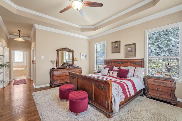 bedroom featuring baseboards, multiple windows, dark wood-style flooring, and crown molding