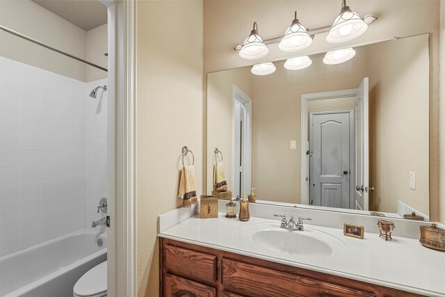 full bathroom featuring toilet, shower / washtub combination, and vanity