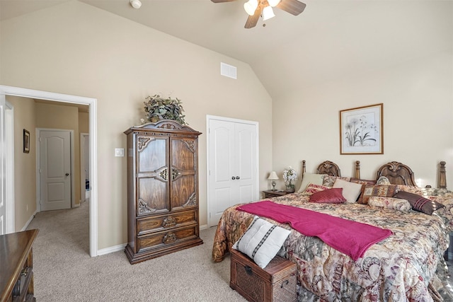 bedroom with a ceiling fan, visible vents, carpet floors, high vaulted ceiling, and a closet