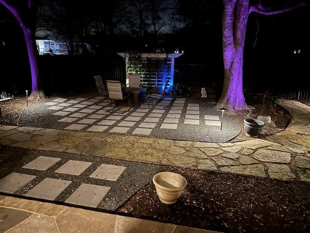 patio at night with an outbuilding