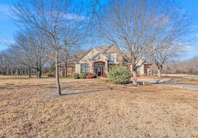 view of front of house featuring brick siding and stone siding