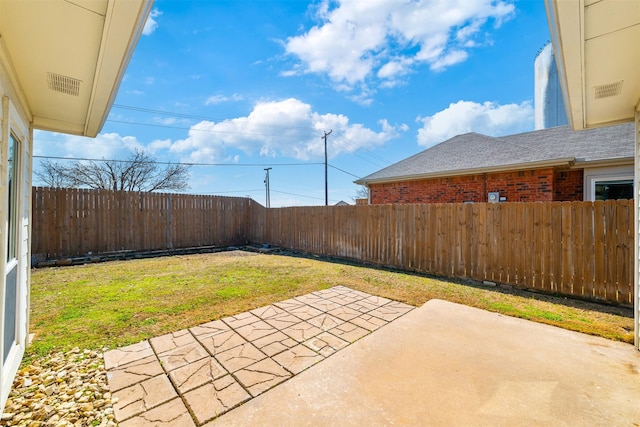 view of yard featuring a fenced backyard and a patio