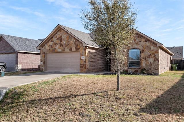 view of front of house featuring a front lawn, stone siding, concrete driveway, an attached garage, and brick siding