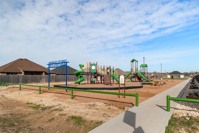 communal playground featuring fence