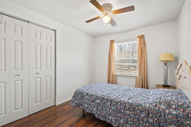 bedroom with dark wood finished floors, a closet, and ceiling fan