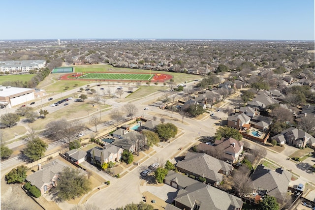 birds eye view of property with a residential view