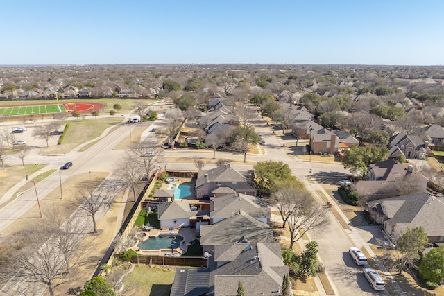 birds eye view of property with a residential view