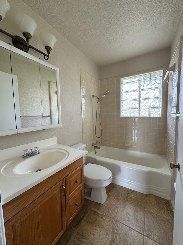 bathroom with vanity,  shower combination, a textured ceiling, toilet, and a textured wall