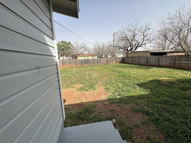 view of yard featuring a fenced backyard