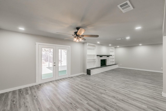 unfurnished living room with baseboards, wood finished floors, visible vents, and recessed lighting