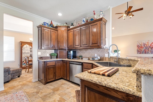 kitchen featuring a sink, light stone countertops, dishwasher, and ornamental molding