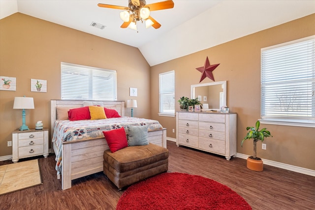 bedroom with lofted ceiling, multiple windows, and visible vents