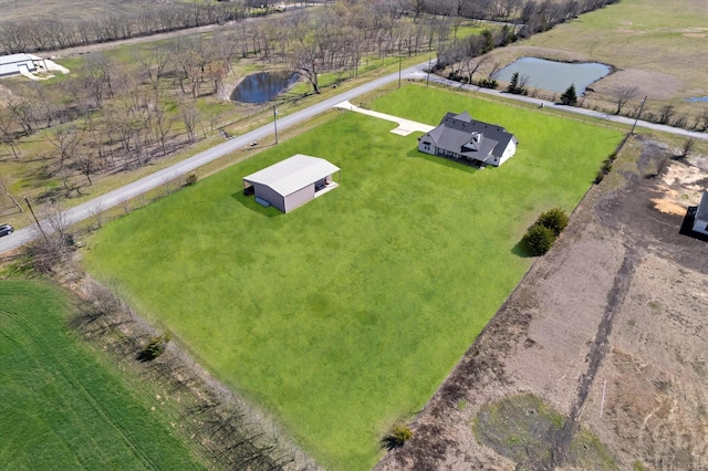 drone / aerial view with a water view and a rural view