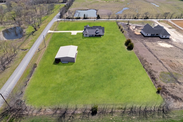 aerial view with a water view and a rural view