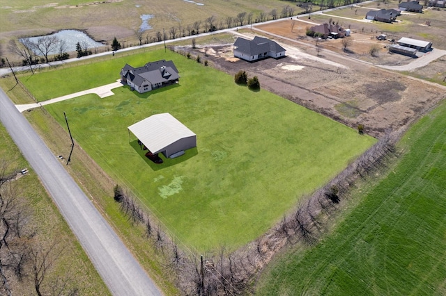 birds eye view of property with a rural view