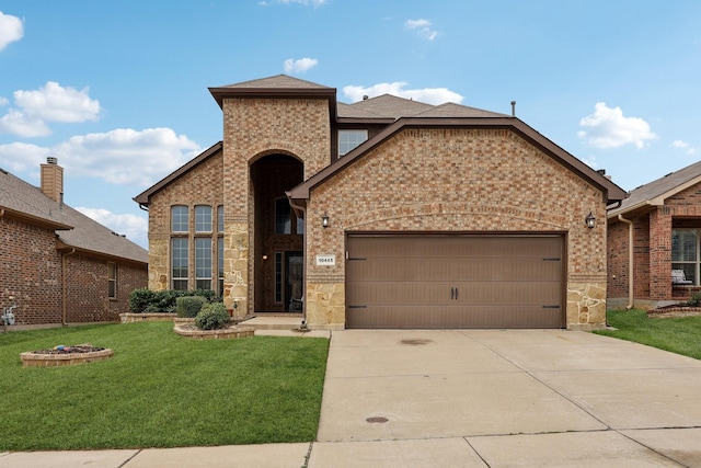 traditional-style home featuring an attached garage, a shingled roof, concrete driveway, a front lawn, and brick siding