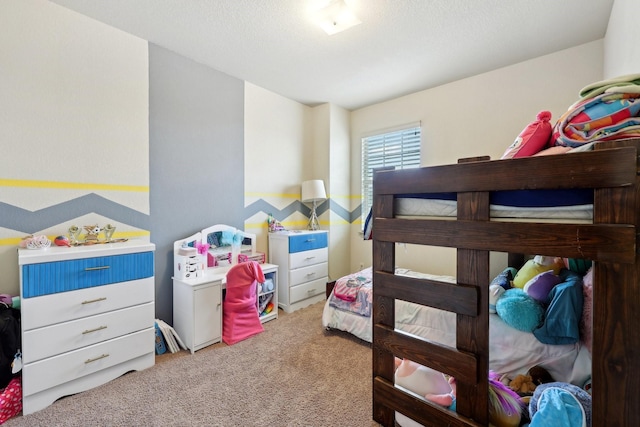 bedroom featuring carpet floors and a textured ceiling